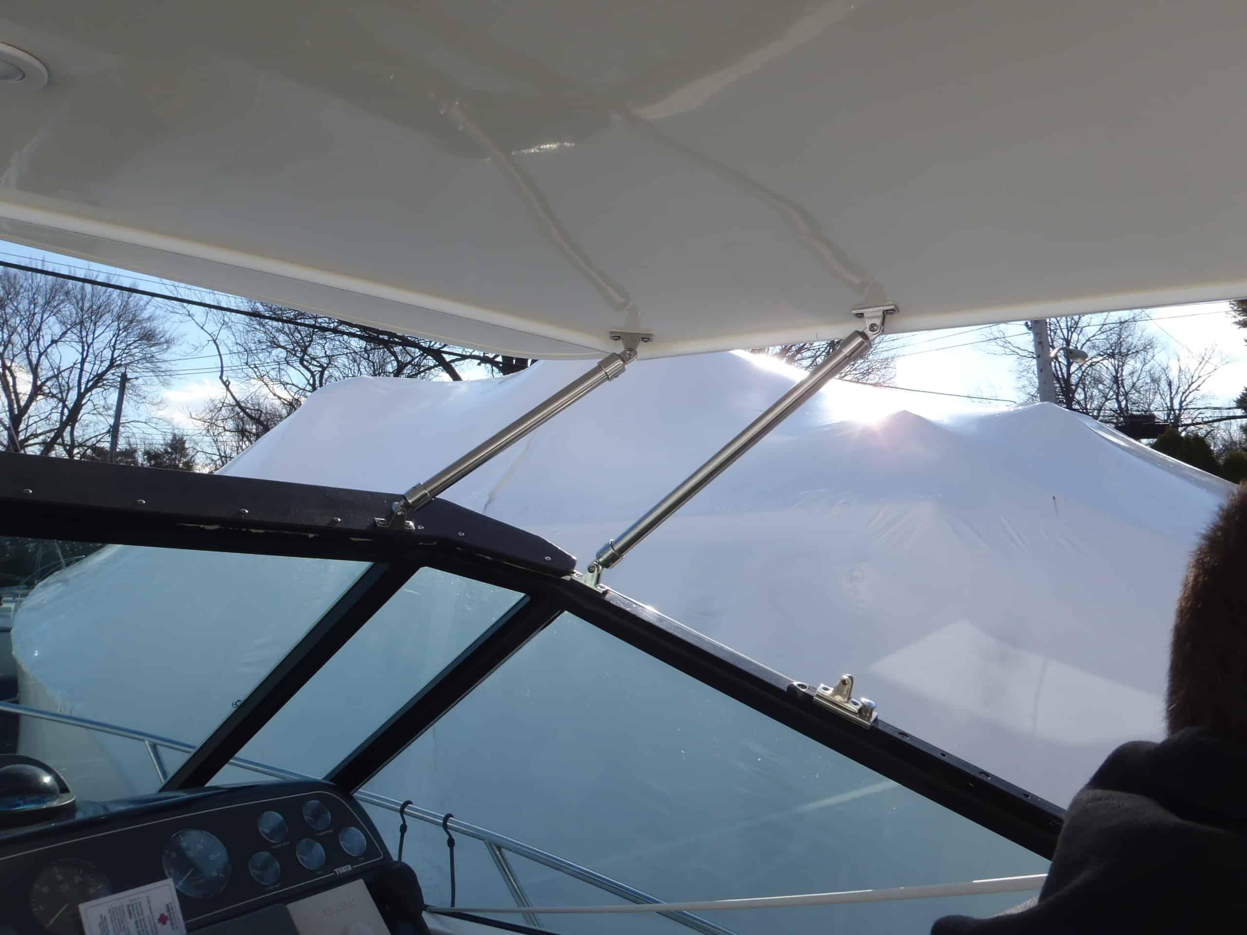 Atlantic Towers Top installed on a Tiara 3100 Open cruiser boat, showing the helm area and interior seating.