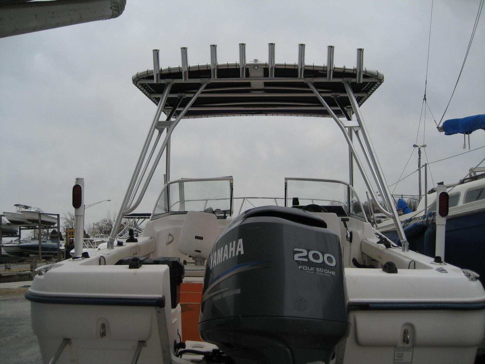 Atlantic Towers top installed on a Palm Beach 220DC dual console boat, showcasing a sleek design and effective sun coverage.