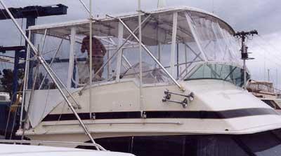 Atlantic Towers Top installed on a Bertram 46 Convertible boat, showcasing the boat's bridge area with weather protection.