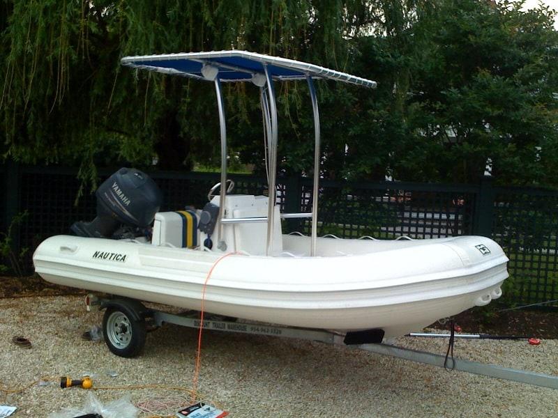 Atlantic Towers T-Top installed on a Nautica CC RIB boat, showing the canopy and support frame from the side.