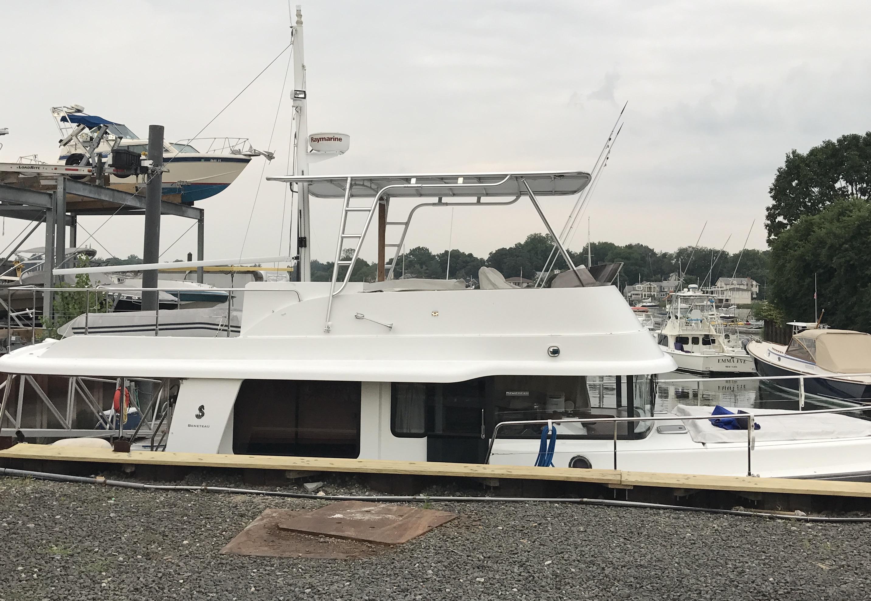 Atlantic Towers Top installed on a Beneteau boat at a marina, with other boats visible in the background.
