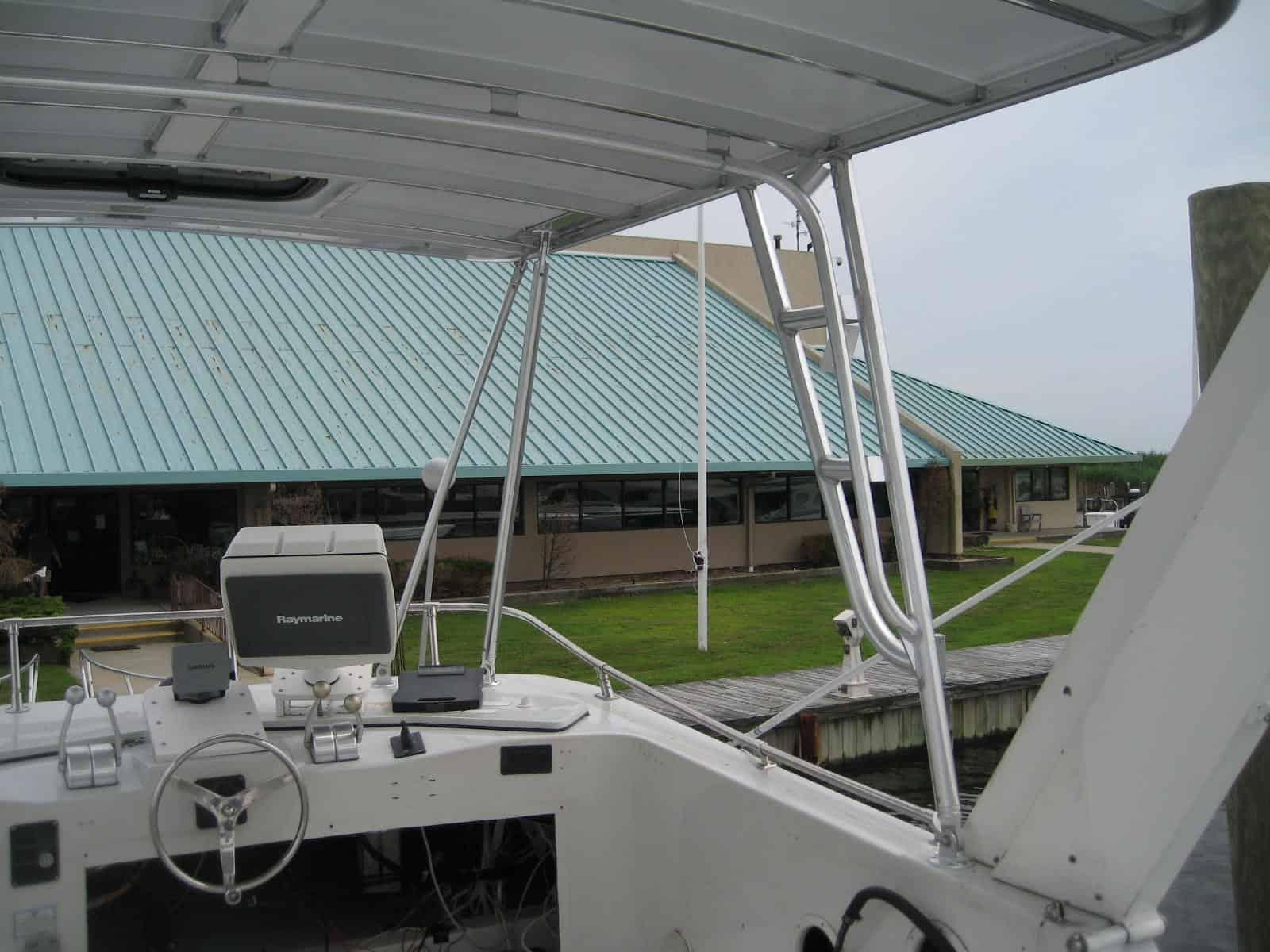 Atlantic Towers Top installed on a Blue Water Boats 60 houseboat, showcasing a modern design and sturdy construction.