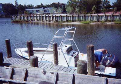 Atlantic Towers Air Tower installed on a Sea Craft 20 Super Fisherman boat at a dock by the water.