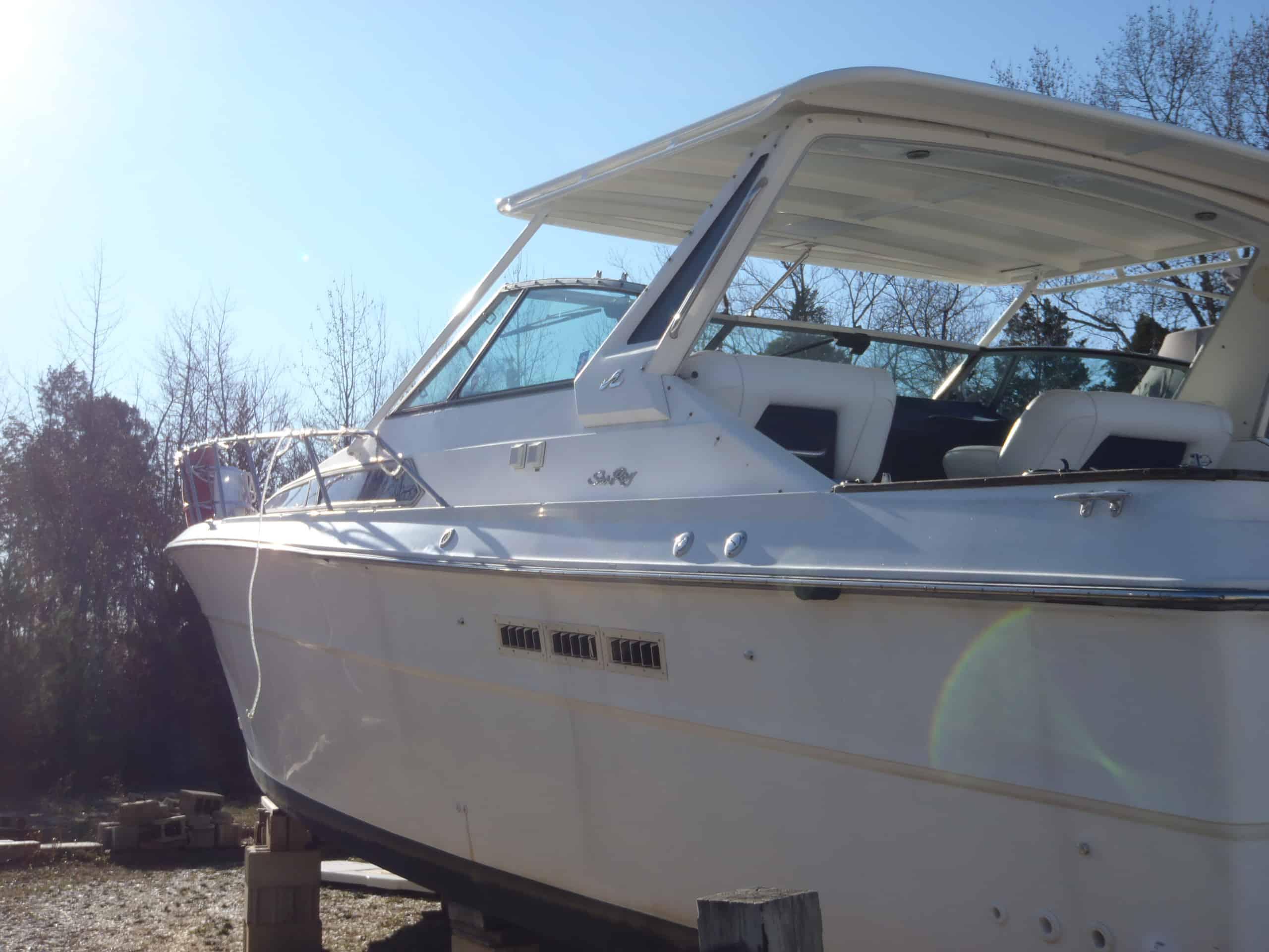 Atlantic Towers T-Top installed on a boat, showcasing its sleek design and functionality against a clear blue sky.