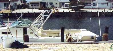 Atlantic Towers Accessories installed on a Seamaster 2588 Walkaround boat at a dock.