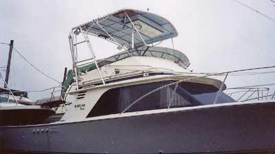 Atlantic Towers Top installed on the upper flybridge of a Blackfin 29 Flybridge boat shown docked in a marina.