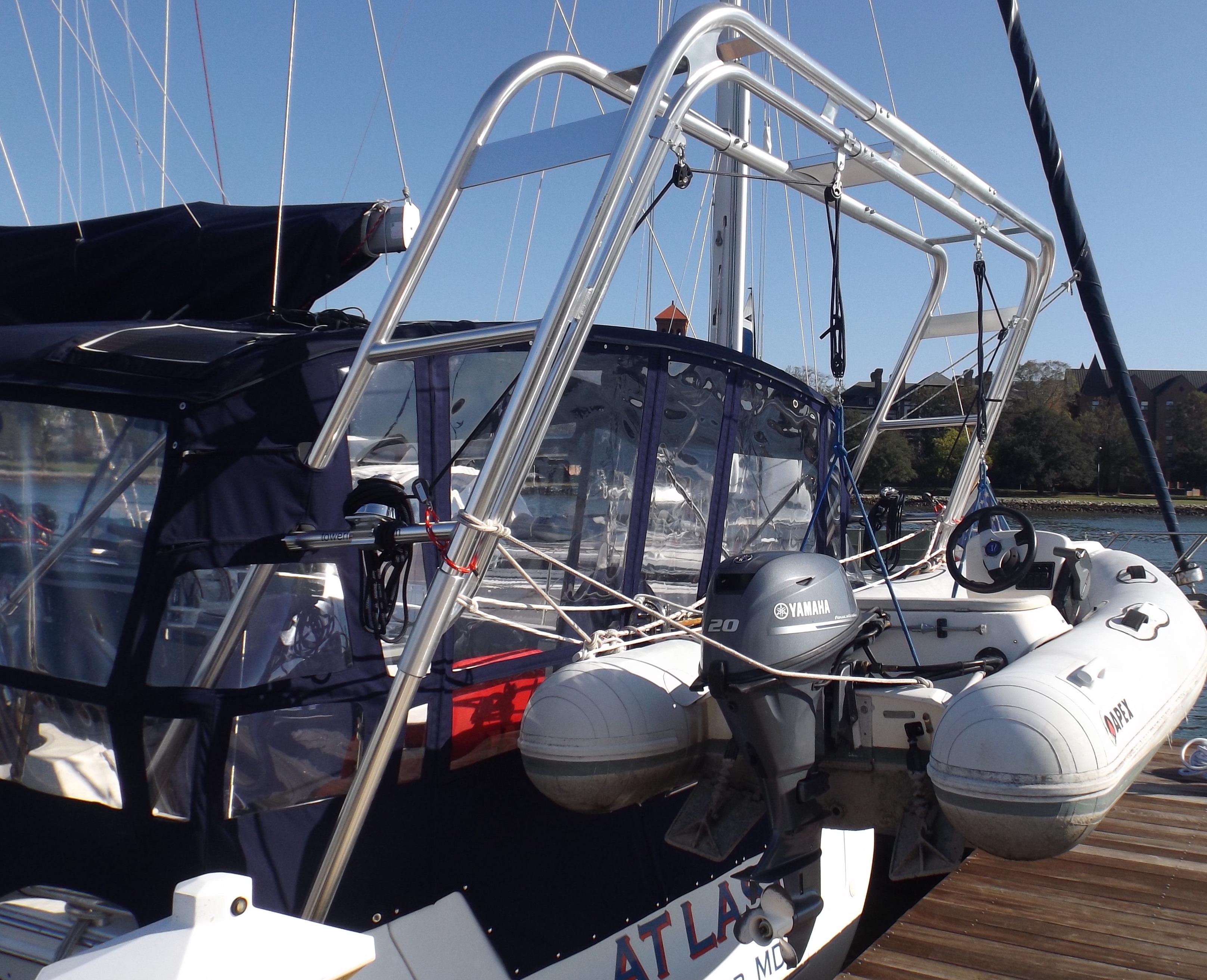 Atlantic Towers Arch installed on a Beneteau boat, featuring a Yamaha outboard motor and protective canopy.