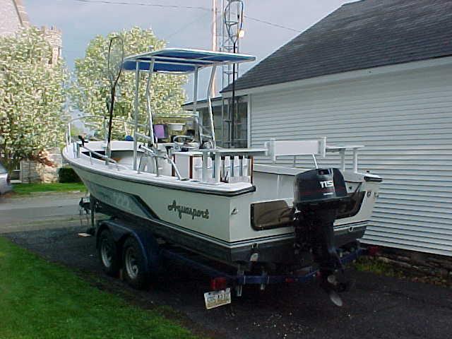 Atlantic Towers T-Top installed on Aquasport 222 CCP center console boat, showing the helm and seating area.