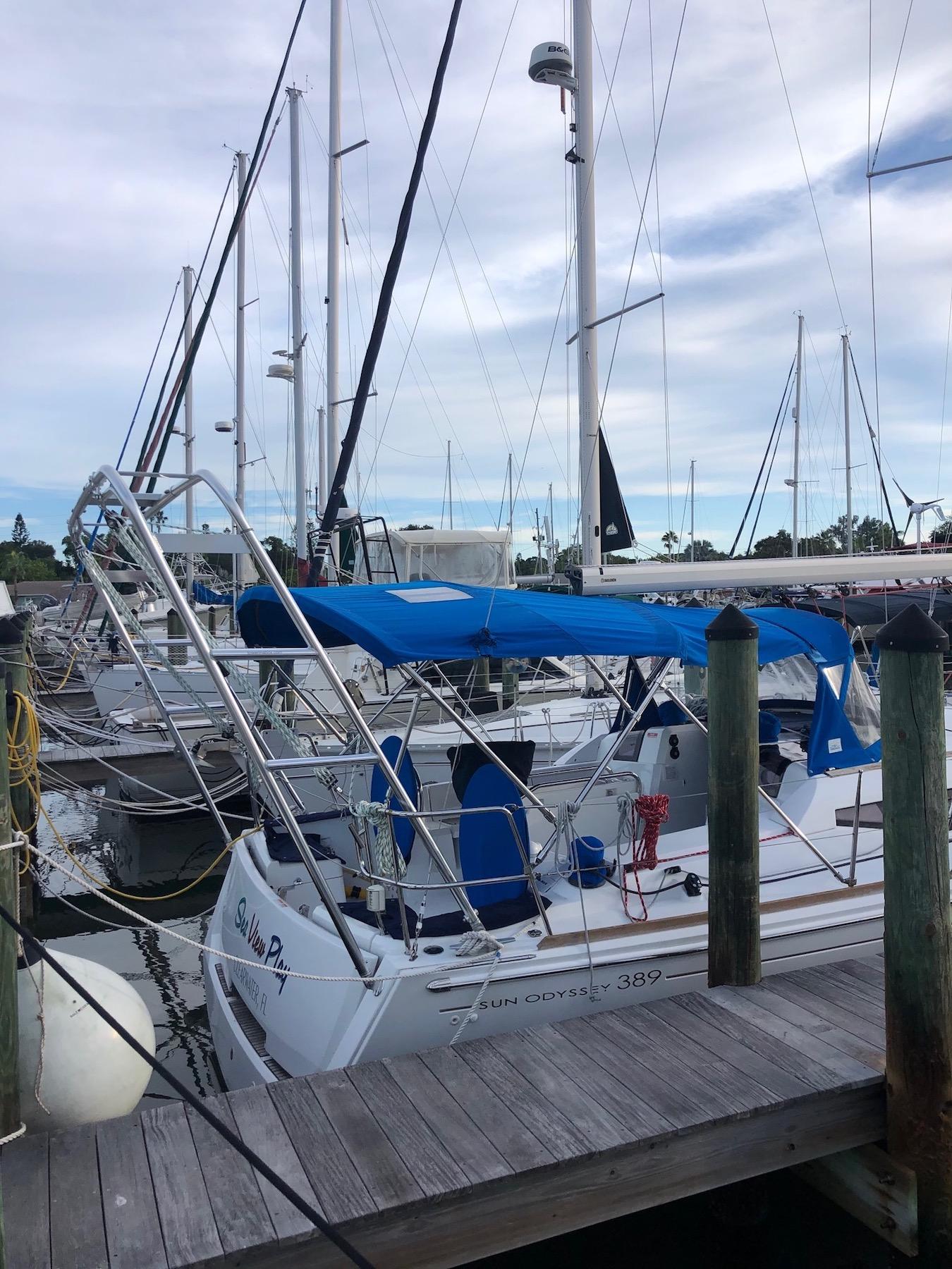 Atlantic Towers Arch installed on a Jeanneau Sun Odyssey 389 docked at a marina, surrounded by other boats.