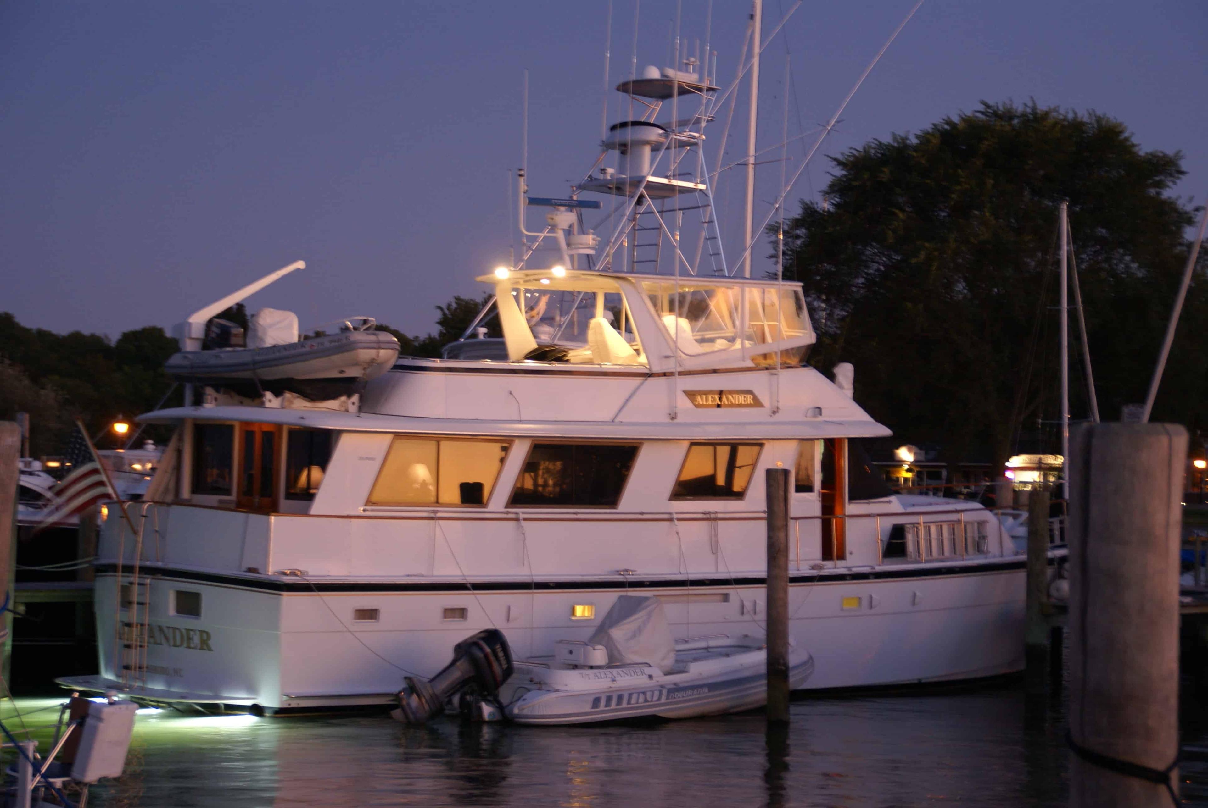 Atlantic Towers Top installed on a Hatteras 61 Motor Yacht docked at night, illuminated by soft lights.