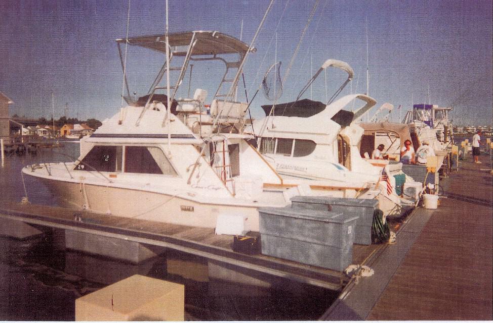 Atlantic Towers Top installed on a Chris Craft 30 Tournament SF docked at a marina, with other boats in view.
