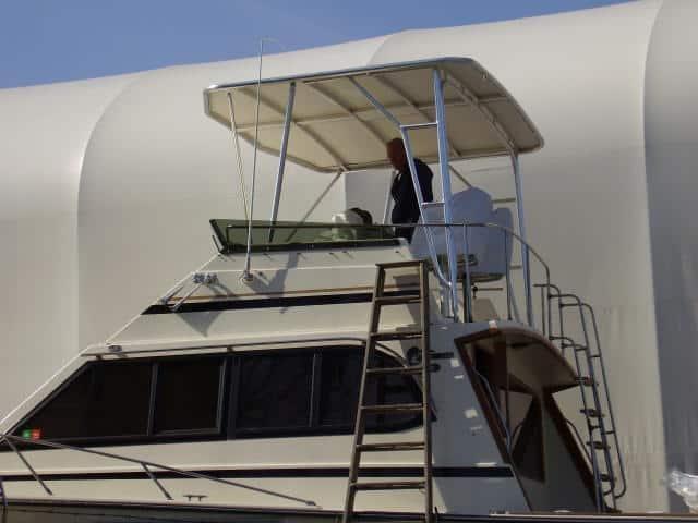 Egg Harbor 37 Convertible boat with installed Atlantic Towers Top providing overhead shade on the flybridge.