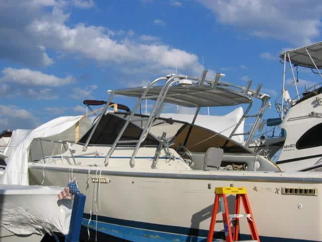 Atlantic Towers Top installed on a Phoenix 27 Weekender boat, with clouds in the background and a ladder nearby.