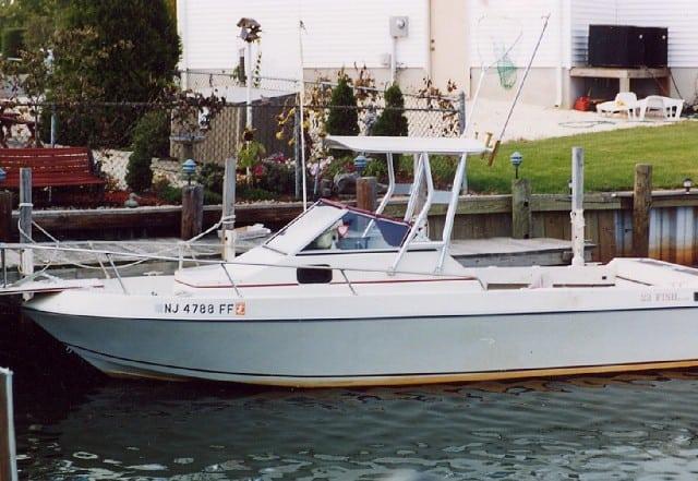 White IMP boat with registration NJ 4788 FF showing installed Atlantic Towers Top docked near a residential waterfront property