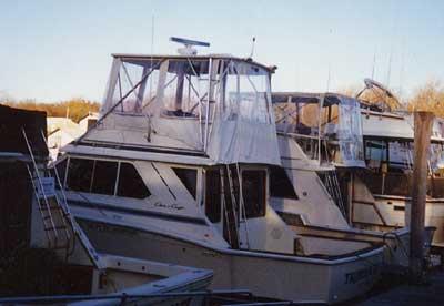 Atlantic Towers Top installed on a Chris Craft 382/392 Sport Sedan boat in a marina setting.
