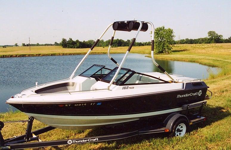Atlantic Towers Air Tower installed on a Thundercraft boat, parked near a pond on a sunny day.