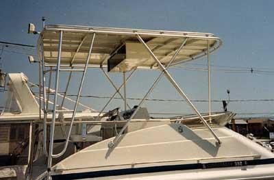 Atlantic Towers Top installed on a Chris Craft 382/392 Sport Sedan boat providing shade and structure on the deck.