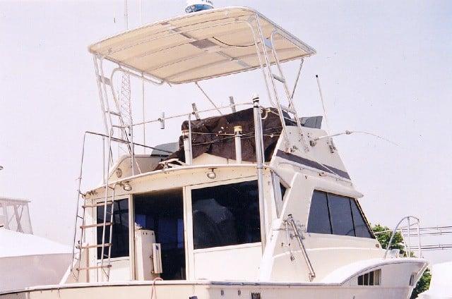 Chris Craft boat with installed Atlantic Towers Top providing shade over the upper deck helm area