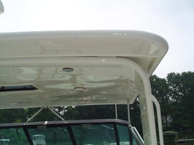 Close-up of Atlantic Towers Top installed on the Tiara 40 Express boat, showing the overhead structure and part of the windshield.