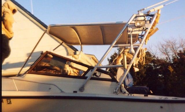 Atlantic Towers Top installed on Mako 258 Walkaround boat providing shade over the cockpit area during sunset.
