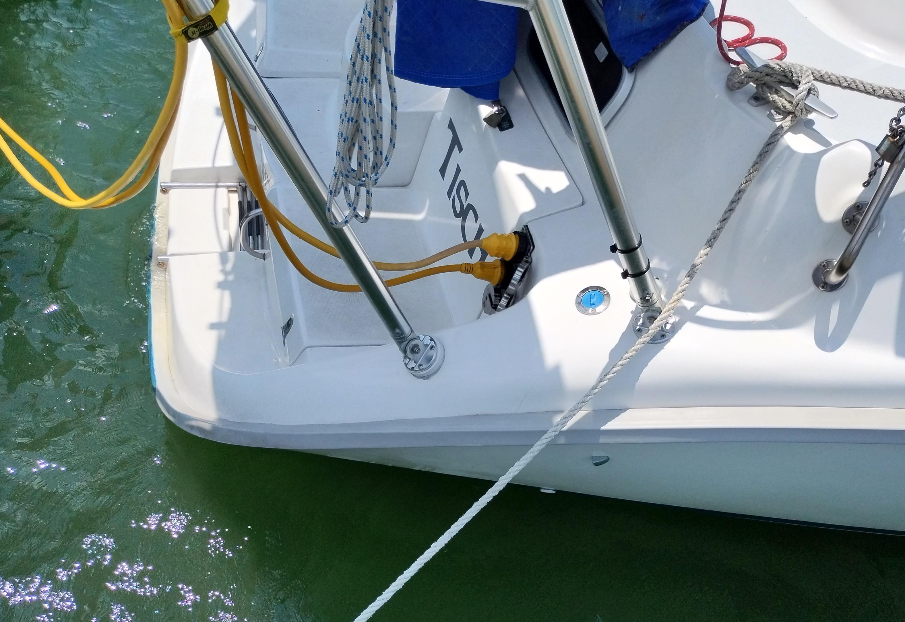 Atlantic Towers Arch installed on a boat, featuring electrical connections and a rope secured on deck.