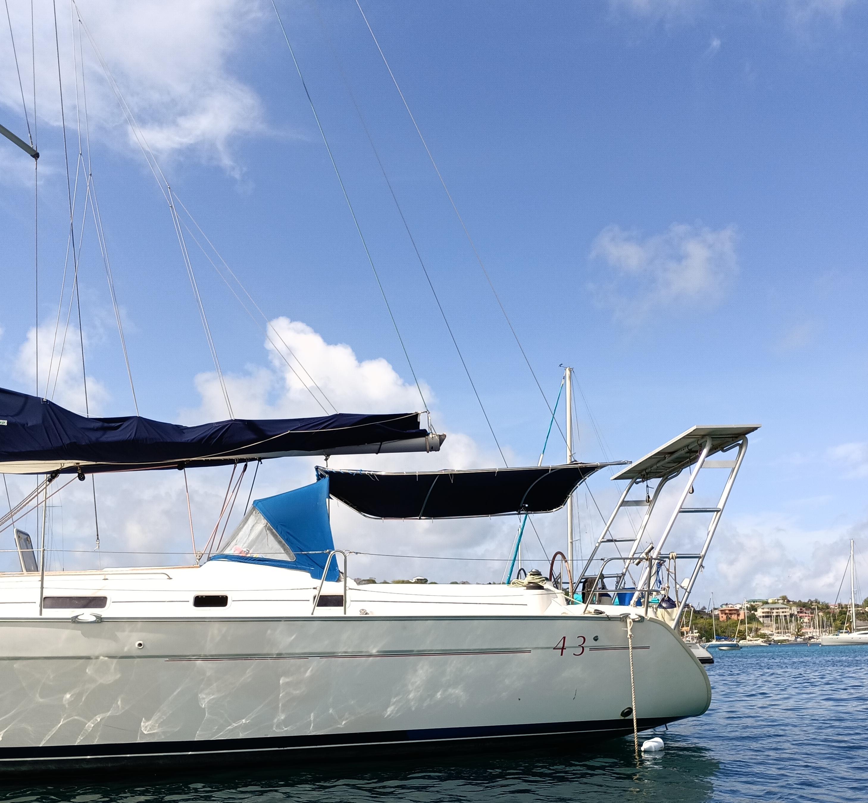 Atlantic Towers Arch installed on a Beneteau boat, showcasing the arch structure against a clear blue sky.