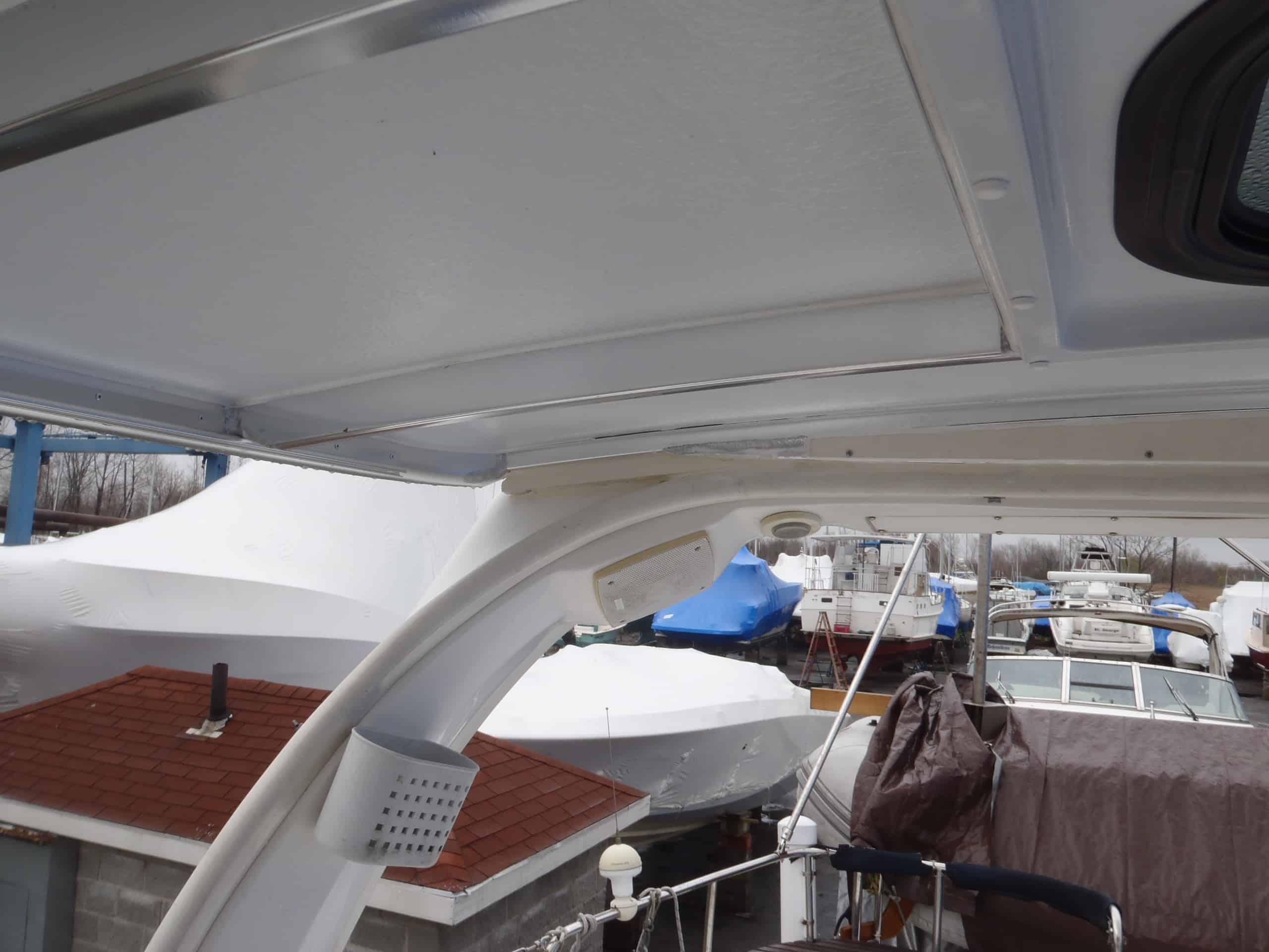 Atlantic Towers Top installed on Hunter 420 sailboat under a clear blue sky with calm waters in the background