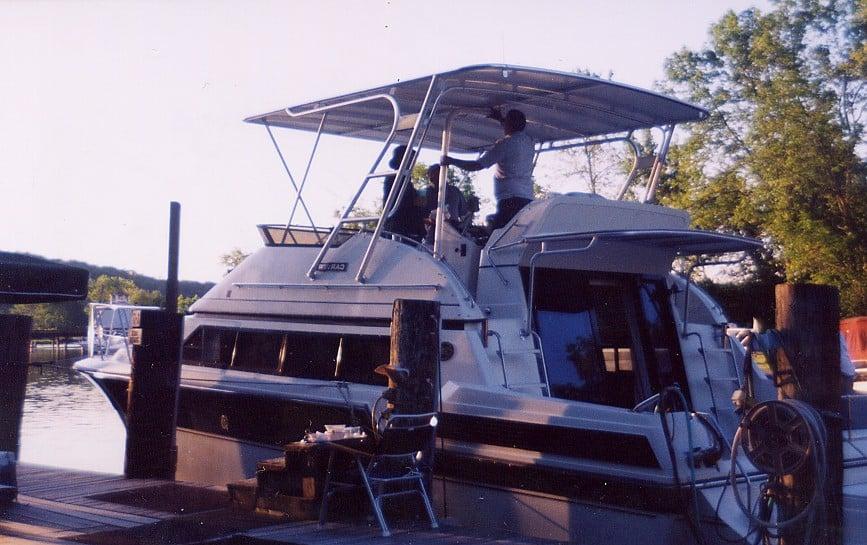 Atlantic Towers Top installed on a Carver 28 Mariner/Voyager boat at a dock, with people onboard.