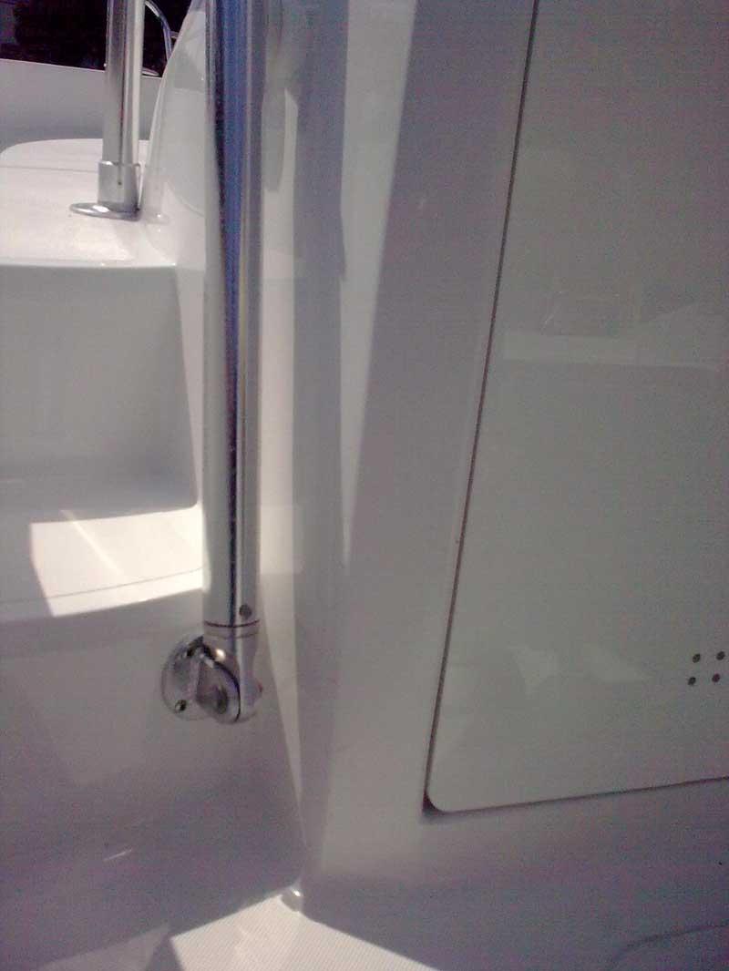 Atlantic Towers T-Top installed on a sleek, modern boat, showcasing polished stainless steel and white surfaces.
