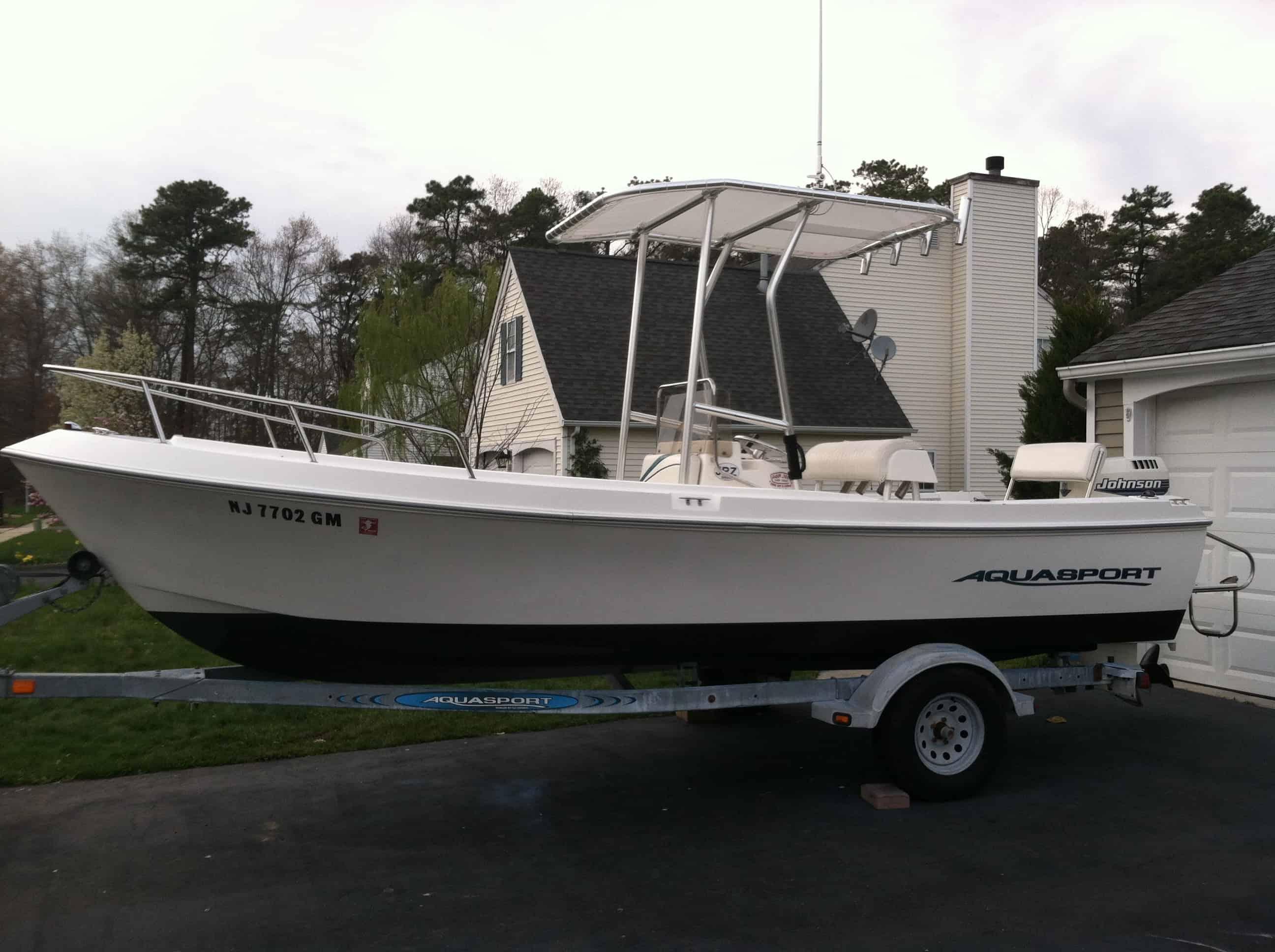 Atlantic Towers T-Top installed on Aquasport 200 Osprey center console boat, showing helm and seating area.