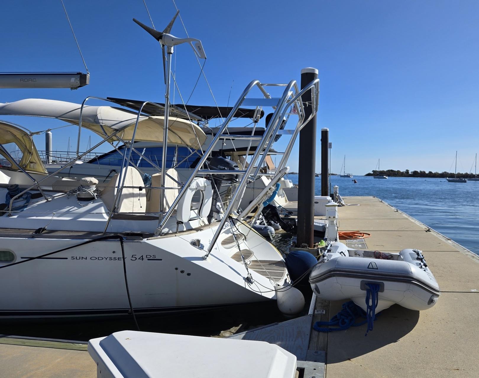 Atlantic Towers arch installed on a Jeanneau Sun Odyssey 54DS docked at a marina on a clear day.