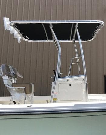 Atlantic Towers T-Top installed on a boat with a beige console and seating, showcasing a sleek design.