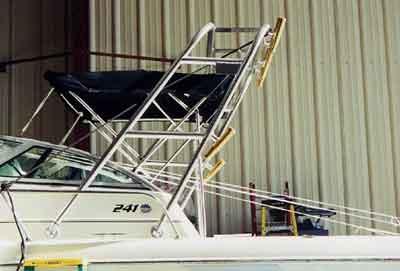 Atlantic Towers Arch installed on a Pro Line 241 Walkaround boat with fishing rod holders and canvas cover.