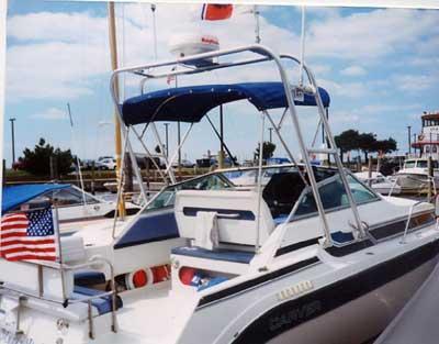 Atlantic Towers Arch installed on a Carver 2157 Montego boat, showcasing its functional design at a marina.