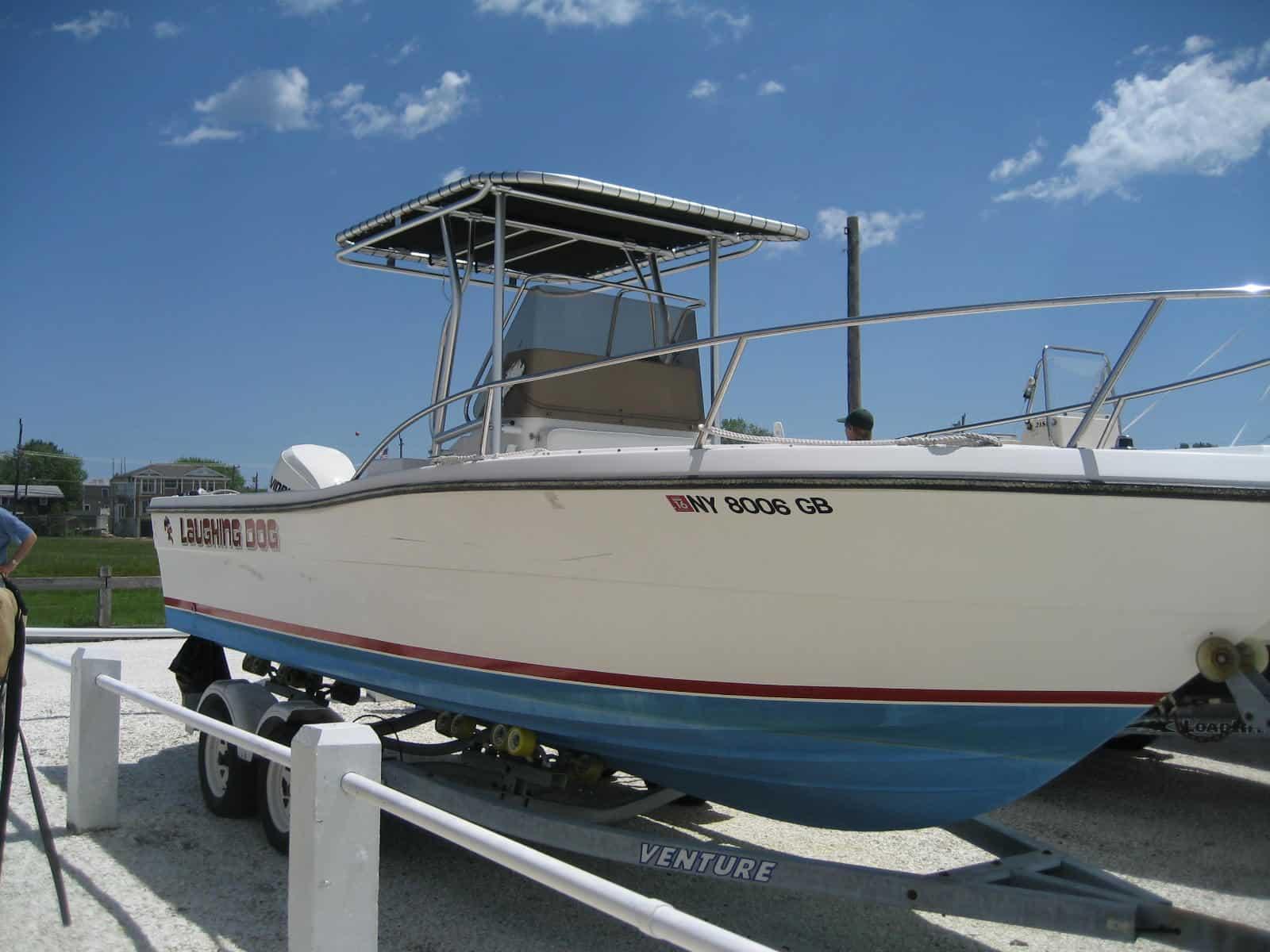 Atlantic Towers T-Top on a Pursuit 24 center console boat, showcasing a sturdy design for sun protection.