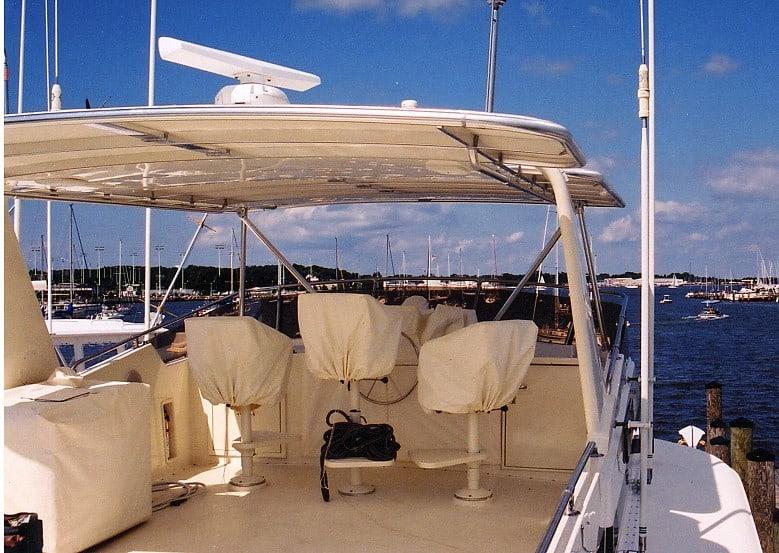 Atlantic Towers Top installed on a Hatteras 63 Motoryacht, showcasing the helm and seating area.