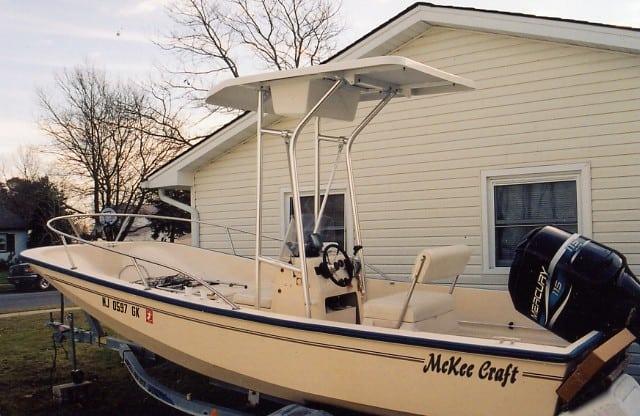 Atlantic Towers T-Top installed on a McKee Craft 17.5 center console boat, with seating and controls visible