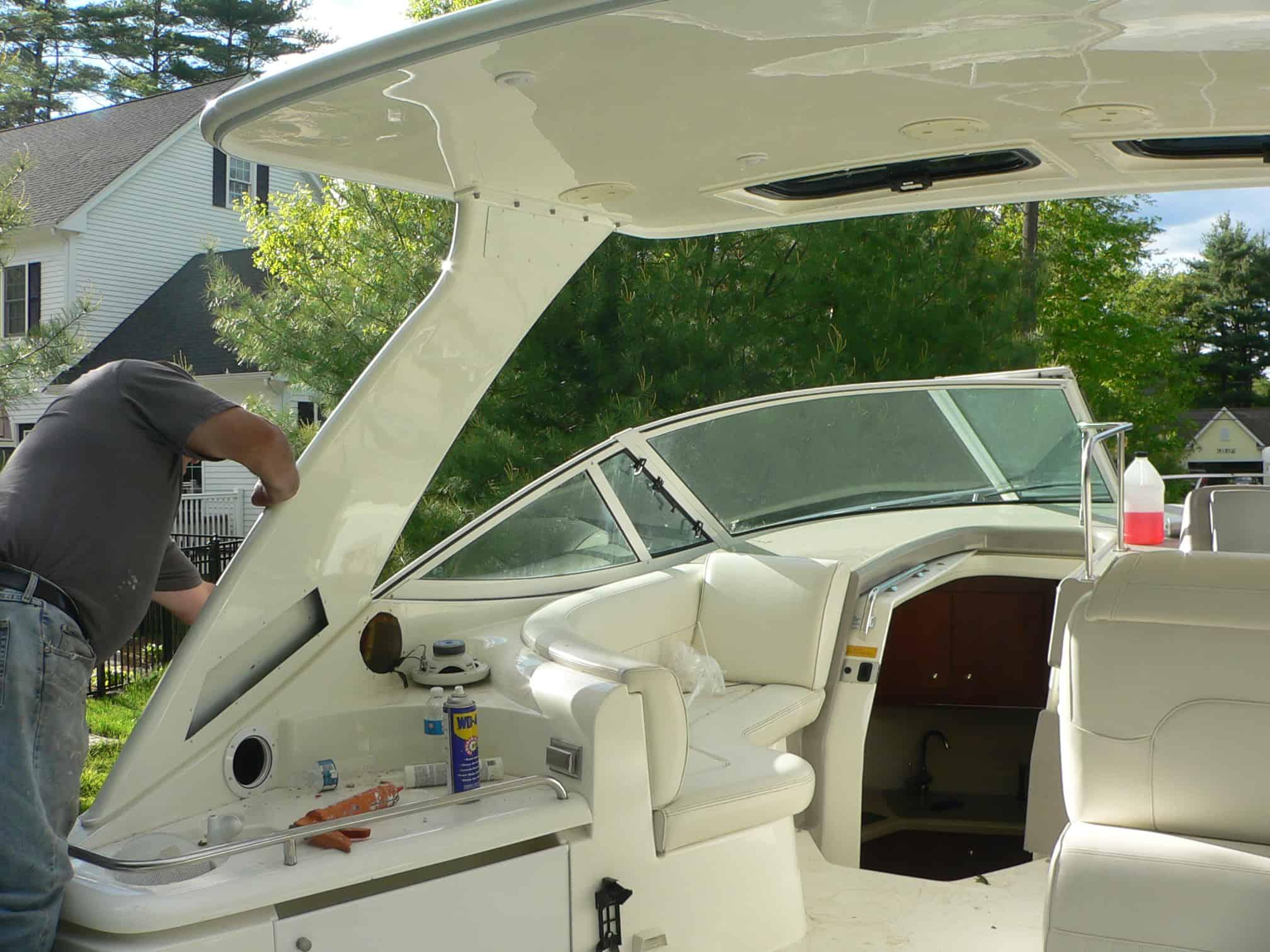 Atlantic Towers Top installed on a Cruisers 340 Express boat, with a man working on the interior features.