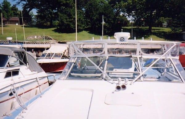 Atlantic Towers Top installed on a Trojan 10 Meter boat, docked among other vessels at a marina.