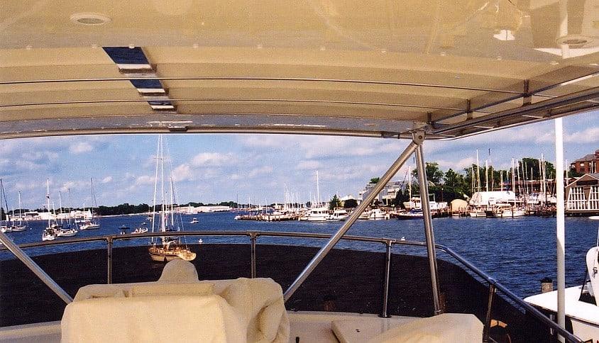 Atlantic Towers Top installed on a Hatteras 63 Motoryacht, showcasing a view of the marina and boats.