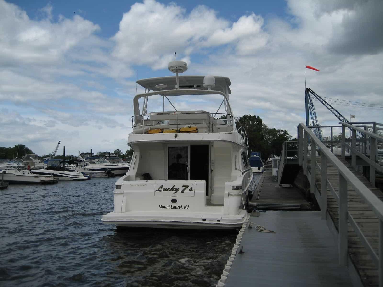 Atlantic Towers Top installed on a Silverton 38 Sport Bridge sedan boat with a white radar dome and seating area