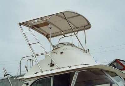 Atlantic Towers Top installed on a Bertram 31 Flybridge Cruiser, showing the boat's flybridge structure.