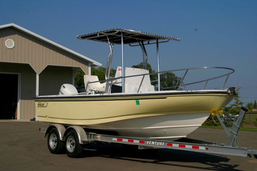 Atlantic Towers T-Top installed on a Boston Whaler 19/20 Outrage center console boat shown against water background