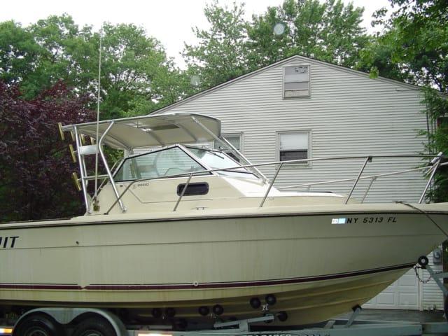 Atlantic Towers Top installed on a Tiara 2600 boat, parked in front of a residential building.