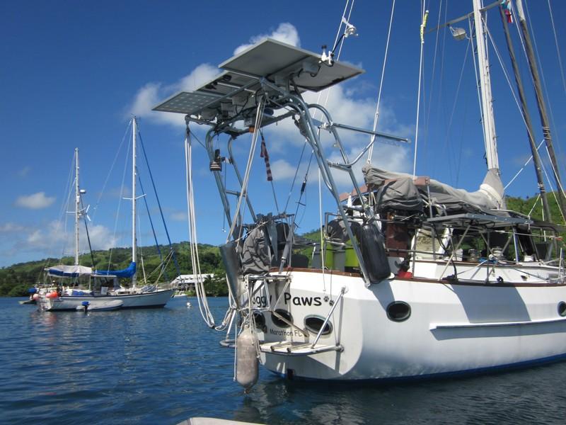 Stern view of a CSY 44 sailboat equipped with an Atlantic Towers Arch installed, docked in a calm marina.