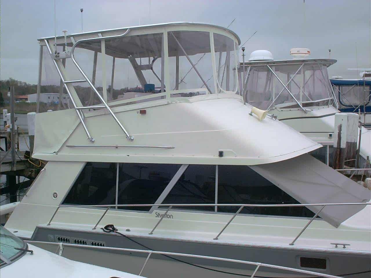 Atlantic Towers Top installed on a Silverton 40 Convertible boat, showcasing a sleek design at the marina.