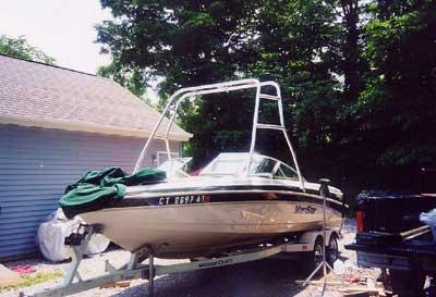 Atlantic Towers Air Tower installed on a Mastercraft 225/230 boat, parked on a trailer in a residential area.