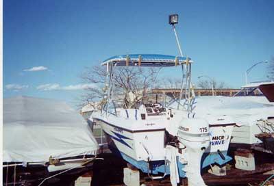 Atlantic Towers Top installed on a Hydra Sports 2000 DC boat, moored among other watercraft.