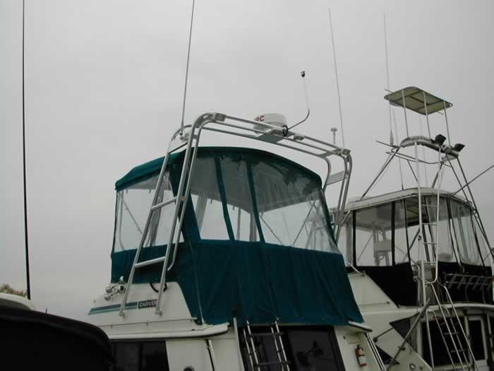 Atlantic Towers Arch installed on a Carver boat, featuring a canvas top and radar on the roof.