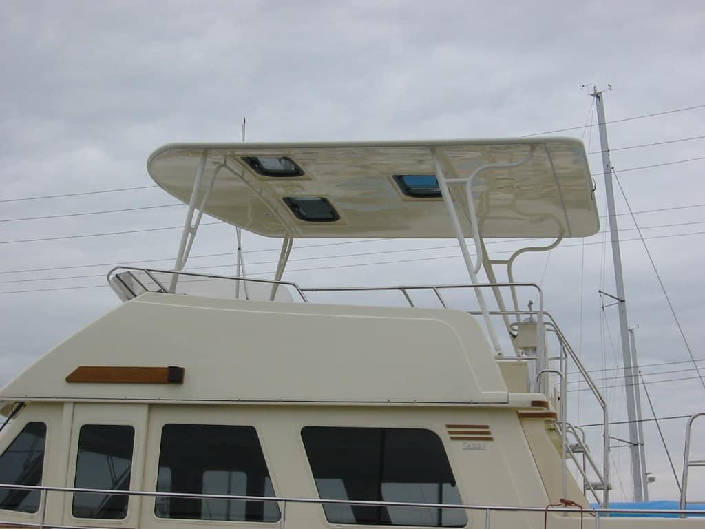 Atlantic Towers Top installed on a Sabreline 47 Aft Cabin boat, viewed from the rear under cloudy skies.